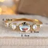 Anillo Fino Rongxing Transfronterizo con Piedra Principal Ovalada, Adornado con Piedras Redondas en Ambos Lados del Anillo, Anillo Cotidiano Suave y Lujoso
