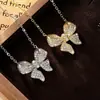 Lindo collar con colgante de moissanita en forma de lazo totalmente adornado para mujer, deslumbrante cadena para la clavícula de diseño único, popular en Xiaohongshu