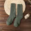 Calcetines de rizo para hombre y mujer calcetines de invierno engrosados de longitud media calcetines de anillo de lana calcetines de mujer color liso calcetines cálidos de toalla venta al por mayor