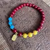 Atacado do Fabricante Ornamentos Vermelhos de Mão para o Ano Novo Chinês Pulseira de Cinábrio Areia Dourada Roxa Baixo Teor Estilo Étnico Dropshipping