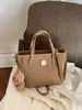 Bolsos de mano para mujer transfronterizos 2026 nuevo modelo principios de otoño bolso de mano simple versátil moda nicho bolso de hombro bandolera tipo cubo