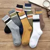 Calcetines para mujer engrosados con forro de felpa calcetines de rizo calcetines de tubo cálidos de invierno absorbentes de sudor transpirables color liso calcetines con base de toalla moda
