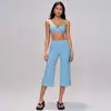 Conjunto de yoga transfronteiriço para mulheres, apresentando um sutiã esportivo de alta qualidade, esportivo e com absorção de choque, calça de yoga de comprimento médio, justa ao corpo, de secagem rápida e cintura alta.. 5555