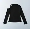 A1023-26 Estilo Novo de Início de Primavera Estilo Europeu e Americano Simples e Único Design Ombro a Ombro Manga Longa Ajustado ao Corpo Camiseta