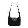 Bolsa de dumplings esmerilada de estilo francés para mujer, nueva moda 2026, bolso de mano elegante, bolso de hombro y cruzado de alta gama