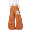Fornecimento Exclusivo Transfronteiriço Marca da Moda Estilo Americano Estampa de Letras Calças Plissadas Scimitar Calças de Paraquedista Unissex Dança de Jazz Calças Largas Soltas