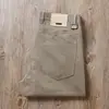 Estación europea pantalones Tencel antiarrugas sin planchar verano finos antiadherentes color gris liso cinco bolsillos de negocios rectos casuales para hombre