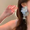 Pendientes de borlas de flores moradas súper etéreos para mujer, sensación de lujo ligero y alta gama, estilo vacacional en la playa, pendientes deslumbrantes y elegantes