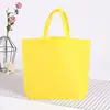 Bolsas de tela no tejida, disponibles en stock, con impresión a color, para ir de compras y como regalo; venta al por mayor del fabricante; bolsas con logo personalizado y bolsas no tejidas