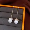 Pendientes de borla con flor de trébol de circonita vintage con un toque de alta gama, pendientes versátiles y de moda al por mayor