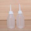 Botella dosificadora industrial botella de agua de plástico 100ML olla dosificadora puntiaguda engrosada con tapa pequeña aceitera