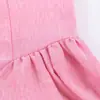 Ropa de mujer al por mayor transfronteriza 2026 verano nuevo estilo europeo y americano cuello redondo elegante ajustado sin mangas vestido largo rosa con botones