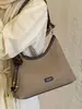 Bolsa de Axila Feminina 2026 Nova Tendência Verão High-End Vintage Versátil Bolsa de Ombro para Trabalho e Deslocamento Bolsa Transversal