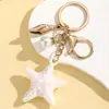 Creativo Vida Marina Colorido Halo Perla Estrella de Mar Llavero Colgante Lindo Colorido Estilo Océano Adorno de Estrella