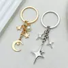 Llavero Popular de Cuatro Puntas Cruz Estrella Luna Transfronterizo Moda Colgante Decoración Simple para Bolso Amazon