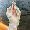 Cadena de llavero de cuentas de colores con luz UV creativa para teléfono móvil, colgante lindo para bolso, accesorios para funda de teléfono móvil, venta al por mayor