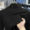 Suéter de cuello alto cruzado al por mayor para hombre, nuevo estilo otoño e invierno 2026, camiseta básica de punto versátil de color liso para hombres de mediana edad