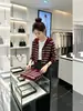 Cárdigan de alta gama para mujer, nueva colección 2026, primavera/otoño, top elegante, suéter de punto con capucha, suéter de rayas, prenda de abrigo