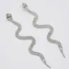 Moda europeia e americana brincos exagerados totalmente cravejados de diamantes franja longa strass formato de cobra design de nicho brincos femininos atacado transfronteiriço