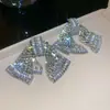 Brincos de borla em formato de flor com zircônia super brilhante, estilo europeu e americano de luxo, brincos de banquete do palácio, brincos de luxo leve de alta qualidade para mulheres