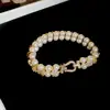 2026 Nuevo Estilo Hebilla de Herradura Pulsera de Perlas de Doble Fila y Circonita Pulsera Elegante Retro Francesa Joyería de Alta Gama