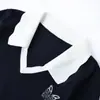 Estilo Universitario Manga Corta Polo Tejido Azul Marino para Mujer Verano 2026 Nuevo Estilo Francés Lujo Ligero Gama Alta Top con Retazos