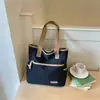 2026 Verão Novo Modelo Alto Valor Casual Grande Capacidade Fashionável Design de Nicho Simples Versátil Bolsa de Ombro de Mão Bolsa Transversal
