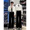 Pantalones rectos de color liso versátiles y sencillos estilo Hong Kong para hombre, otoño 2026, calle alta, holgados, transpirables, casuales, de alta gama.