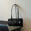 Bolso de axila de diseño de nicho transfronterizo para mujer 2026 Nuevo bolso de hombro de moda Bolso de trabajo de gran capacidad simple para el día a día