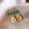 Nuevos pendientes de borlas antiguos chinos, estilo nacional, elegantes pendientes de falda con cara de caballo, accesorios vintage ligeros de lujo de alta gama Yiwu para mujer