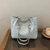 Comercio exterior al por mayor estilo fresco y casual 2026 tela Oxford simple estampada gran capacidad bolso de hombro para dama commuter