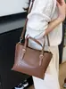 Bolso Pequeño Transfronterizo para Mujer 2026 Nuevo Diseño Retro de Nicho Bolso de Mano Tipo Cubo Bolso de Hombro Cruzado Tejido a la Moda