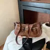Bolsa retrô de moda transfronteiriça 2026 outono nova nicho versátil de alto valor bolsa de axila com fivela de cinto bolsa de ombro