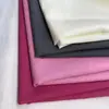 Tejido de algodón y nailon arrugado, material de moda popular para primavera, verano y otoño. Tejido de poliéster y nailon mezclado para camisetas, camisas y vestidos