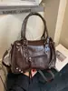 Bolsos transfronterizos 2026 otoño e invierno estilo motero vintage de gran capacidad bolso de mano bolso tote pequeño bolso cruzado de alta gama