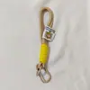 Corda de nylon colorida corda trançada mochila outdoor cordão chaveiro pingente mosquetão bolsa para celular cordão de mão pingente