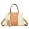 Bolso de mano transfronterizo para mujer, bolso nuevo, moda, costuras, gran capacidad, práctico, temperamento, bolso de hombro cruzado, venta al por mayor