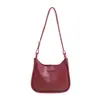 2026 Nova Moda Feminina Temperamento Versátil Elegante Bolsa de Ombro Único Sob o Braço Textura Casual Bolsa de Ombro Cruzado Estilo Balde Tendência