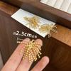 Pendientes con diseño de fuegos artificiales dorados, exquisitos y elegantes, joyería para las orejas, nuevos pendientes con borlas elegantes, accesorios ligeros de lujo para mujer.