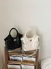 Bolso de mano vintage de alta gama para mujer, nuevo estilo primavera 2026, bolso cruzado y de hombro casual único y moderno