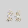Pendientes de lazo clip para oreja espiral de mosquitos sin perforar mujer coreano suave 2023 nuevo de moda otoño e invierno pendientes de perlas