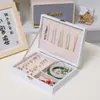 Caja de almacenamiento de joyas, organizador de recuerdos para accesorios de moda, caja de joyería portátil de cuero de una sola capa para anillos y pendientes