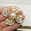 Diamante caliente perla flor de cuatro pétalos accesorios de joyería diy anillo para el cabello cuerda para el cabello material hecho a mano accesorios para el cabello pinza de agarre accesorios diy al por mayor