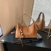 Bolso de gamuza para mujer 2026 nuevo otoño vintage bolso de mano para el trabajo exquisito Maillard bandolera de un solo hombro