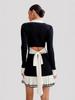 Vestido de punto con tirante de lazo Otoño e Invierno Manga Larga Hebilla de Perla Estilo Chanel Falda con Volantes Europa y América Transfronterizo