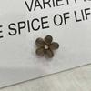 2023 nuevo clip pequeño de flor de piedra ojo de gato clip para fleco de frente tocado súper de hada alta sensación clip de borde de agarre de flor de ciruelo mujeres
