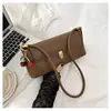Bolsa Pequena de Axila Francesa de Luxo Leve Transfronteiriça Nova Moda Feminina Nicho Bolsa Baguete de Mão Bolsa de Ombro Único de Alta Qualidade Tendência