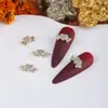 Celebridad de internet nueva joyería para uñas al por mayor circonita lazo tridimensional diamante perla alas de mariposa accesorios de diamante para uñas