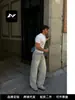 Jeans rectos de estilo americano, lavados, vintage, rotos, ricos, para hombres y mujeres, con un diseño desgastado, de borde deshilachado, casual y de nicho