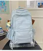 Mochila leve de cor sólida estilo japonês, adequada para viagens ao ar livre, com grande capacidade, versátil para uso casual e ideal como mochila para o dia a dia para estudantes universitários.